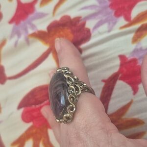 Silver ring with purple shiny stone.expandable